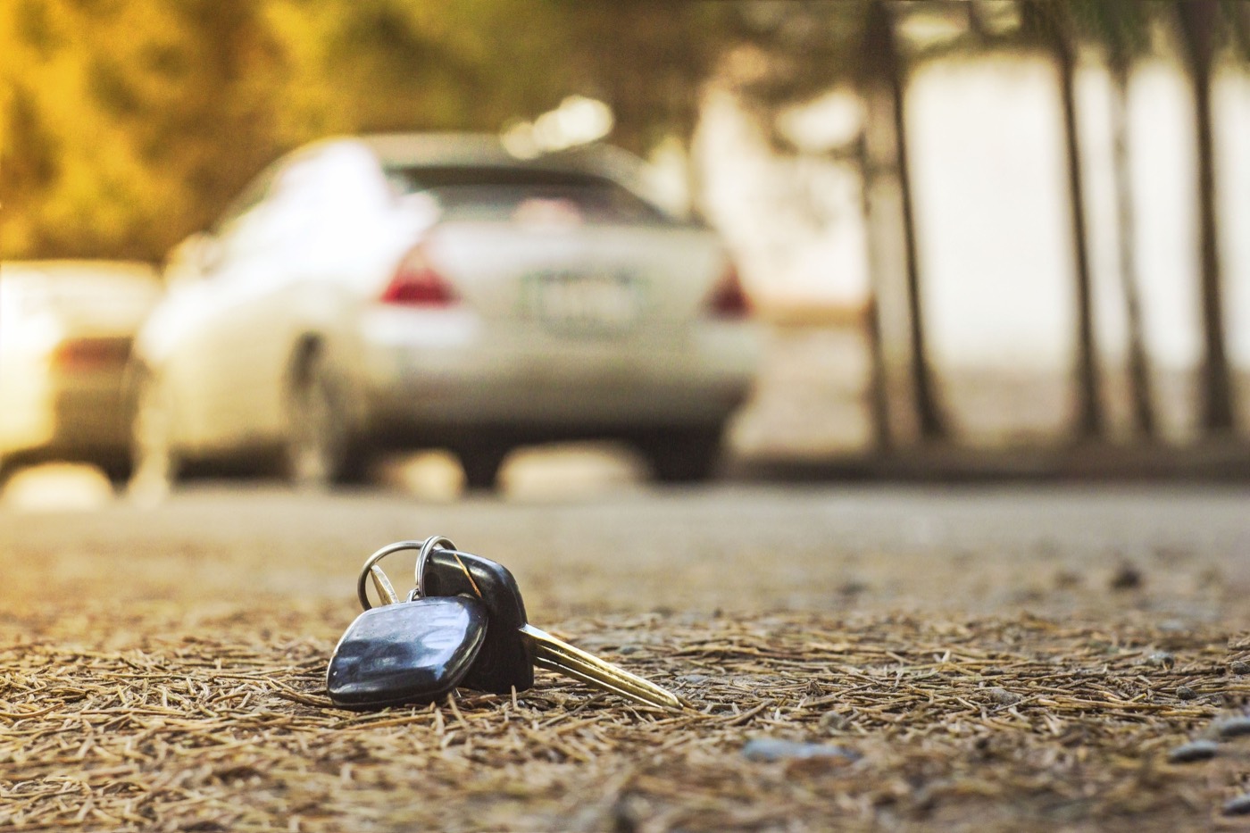 A lost car key dropped on the ground